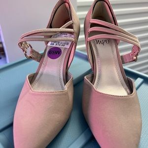 Tan suede pump heels with bottom grips on soles with sexy straps across.